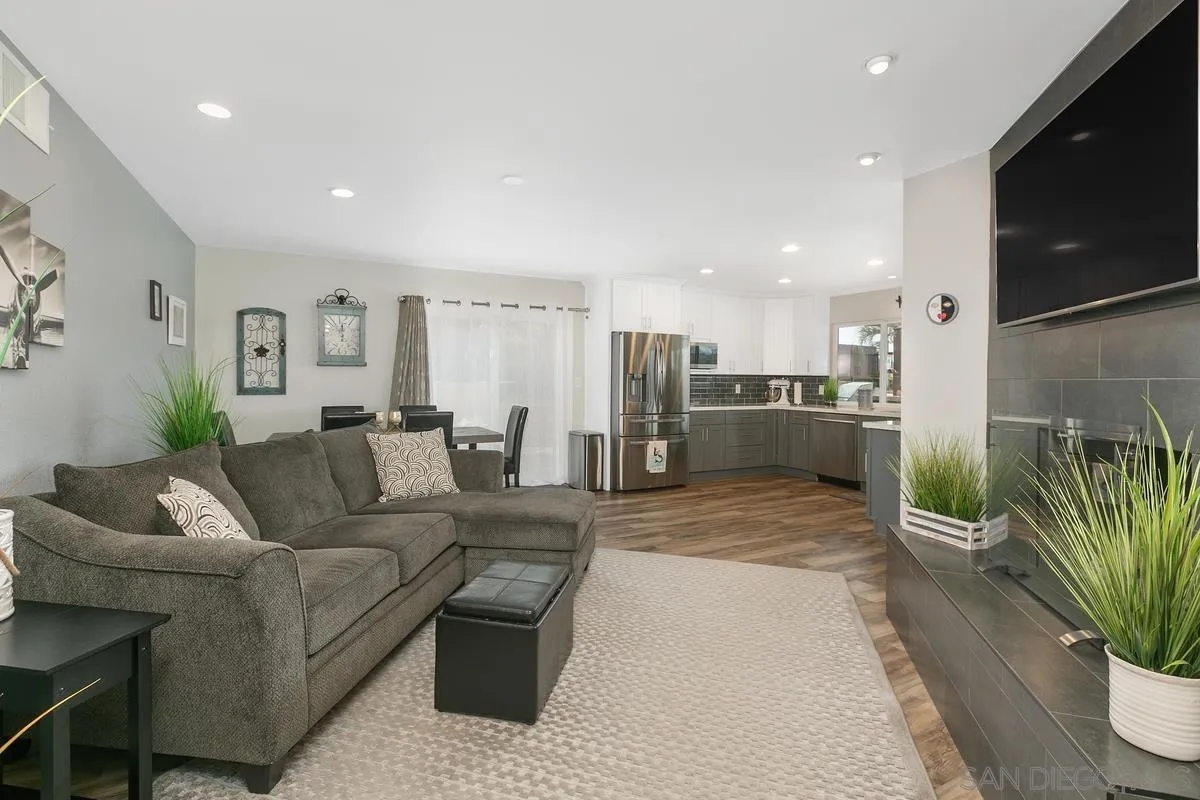 10934 Avenida Roberta Spring Valley, CA 91978 - Photo 13 of 30 a living room with furniture potted plant and kitchen view