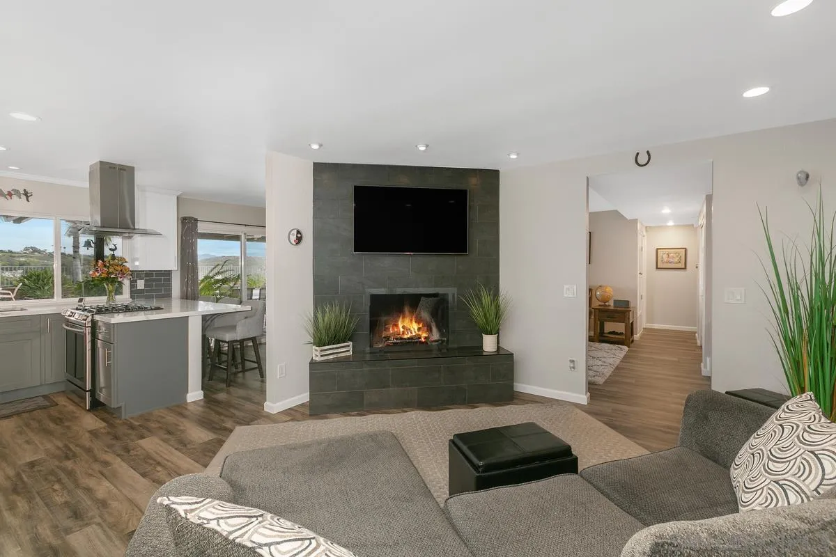 10934 Avenida Roberta Spring Valley, CA 91978 - Photo 14 of 30 a living room with furniture and a fireplace