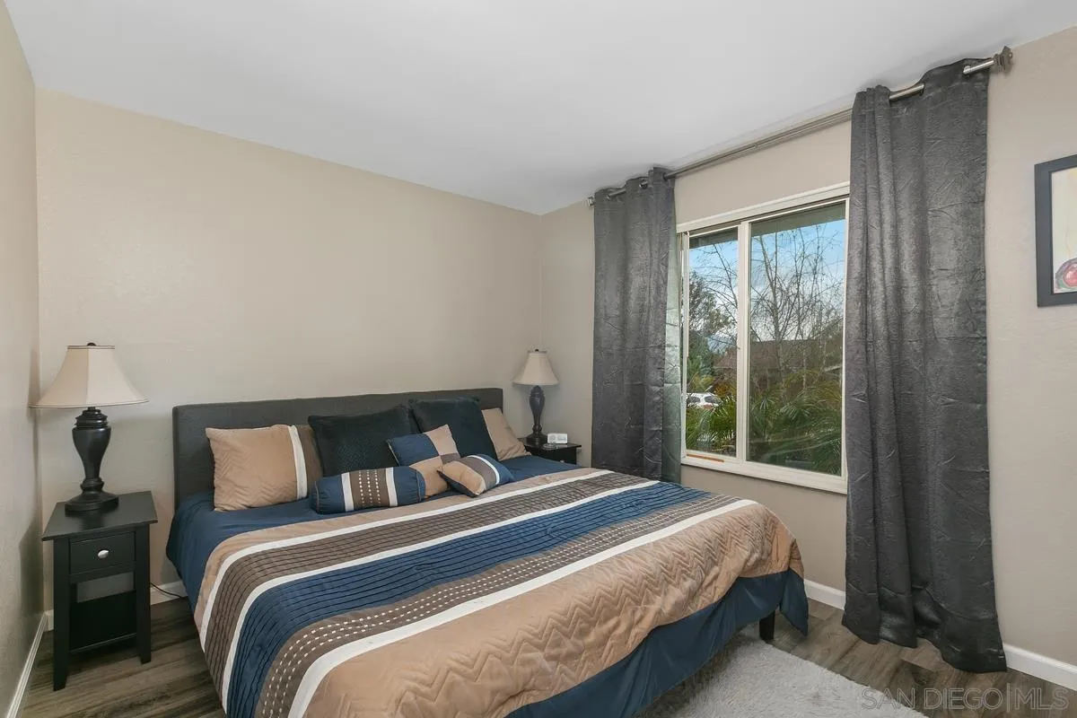 10934 Avenida Roberta Spring Valley, CA 91978 - Photo 20 of 30 a bedroom with a bed and a window