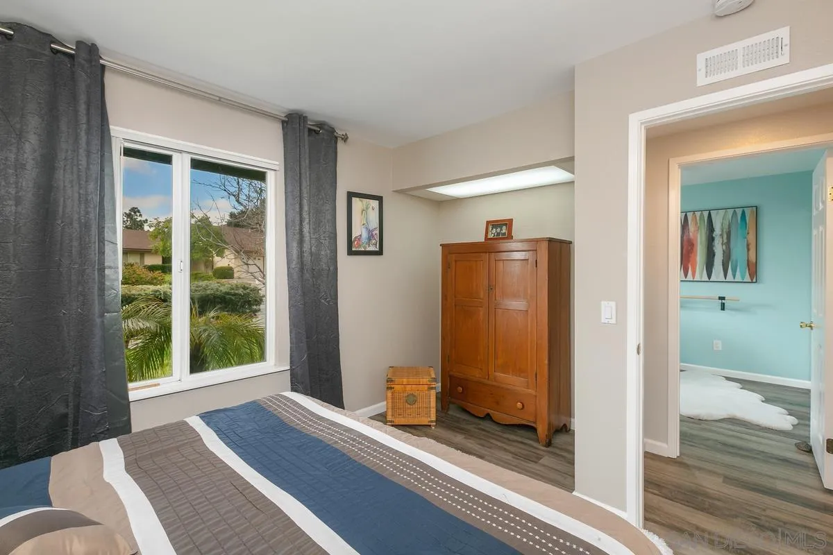 10934 Avenida Roberta Spring Valley, CA 91978 - Photo 21 of 30 a view of a bedroom with furniture and windows