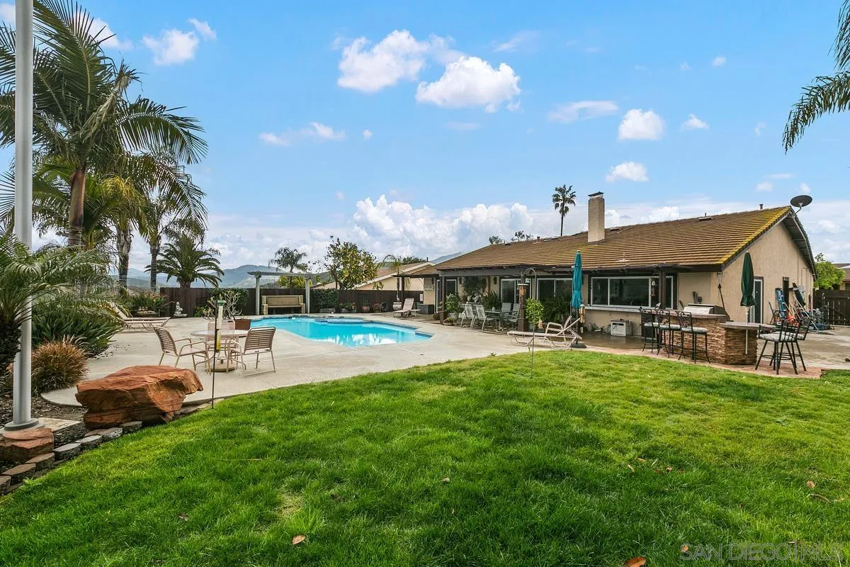 10934 Avenida Roberta Spring Valley, CA 91978 - Photo 26 of 30 a view of a house with swimming pool and sitting area