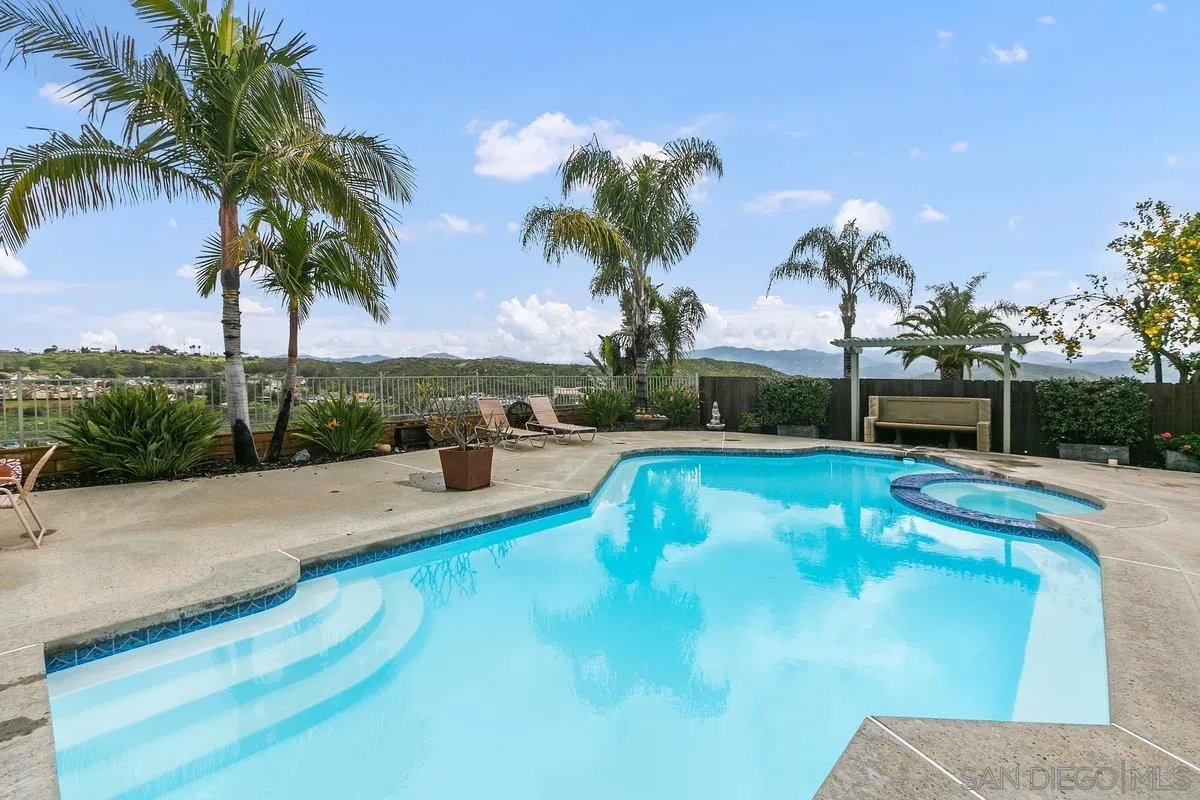 10934 Avenida Roberta Spring Valley, CA 91978 - Photo 27 of 30 a view of a swimming pool with a garden and seating area