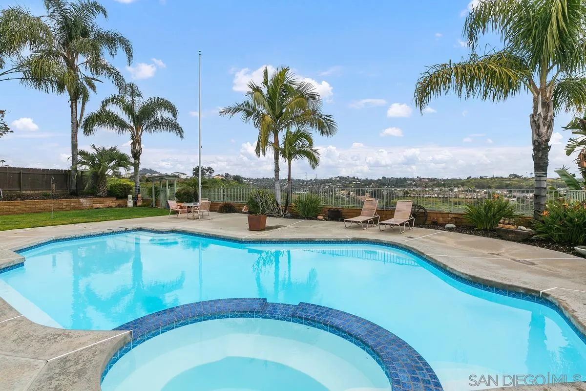10934 Avenida Roberta Spring Valley, CA 91978 - Photo 28 of 30 a view of a swimming pool and trees in a patio