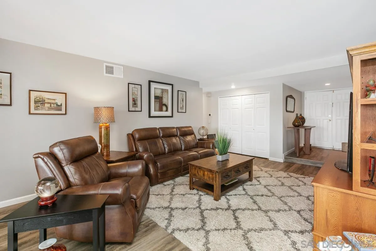 10934 Avenida Roberta Spring Valley, CA 91978 - Photo 7 of 30 a living room with furniture and a rug