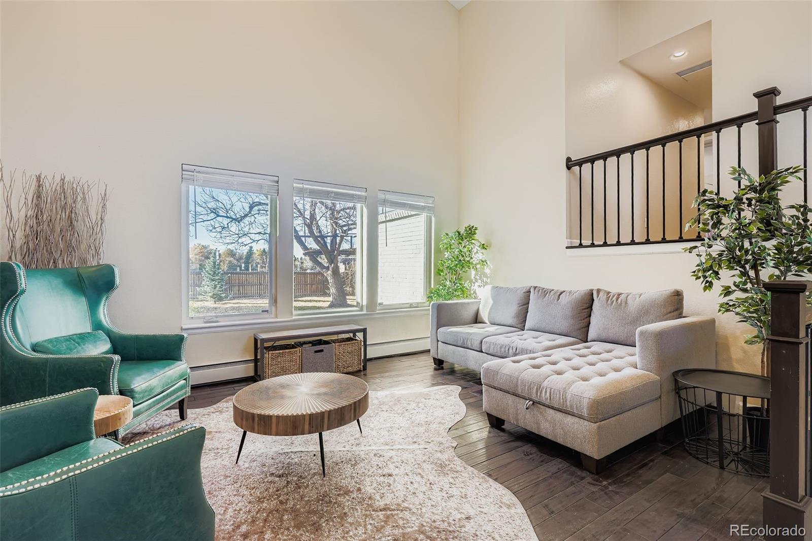 3301 South Magnolia Street Denver, CO 80224 - Photo 2 of 33 a living room with furniture and a large window