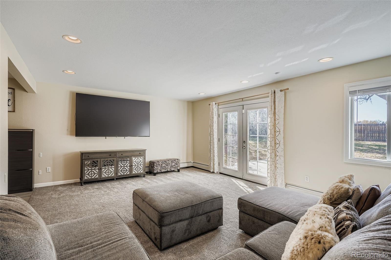 3301 South Magnolia Street Denver, CO 80224 - Photo 21 of 33 a living room with furniture and a flat screen tv