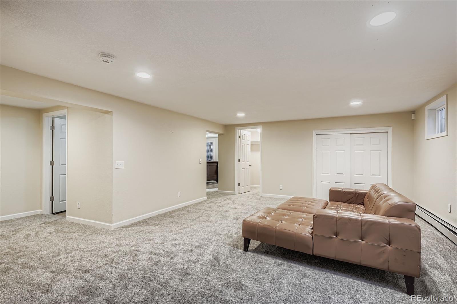 3301 South Magnolia Street Denver, CO 80224 - Photo 22 of 33 a living room with furniture and a window