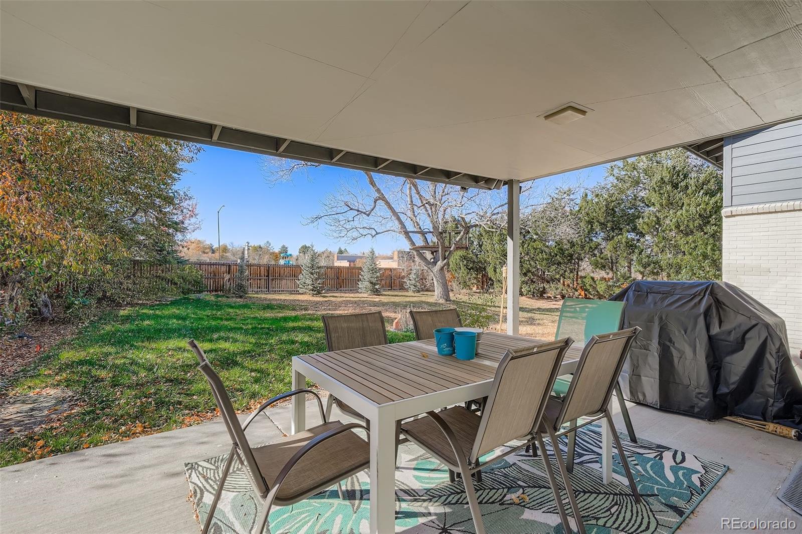 3301 South Magnolia Street Denver, CO 80224 - Photo 26 of 33 a view of a patio with table and chairs and potted plants