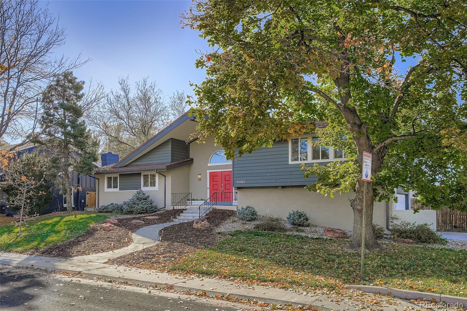 3301 South Magnolia Street Denver, CO 80224 - Photo 28 of 33 a front view of house with yard and trees