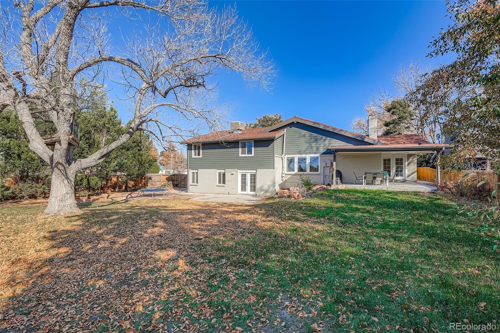 3301 South Magnolia Street Denver, CO 80224 - Photo 29 of 33 a front view of a house with a garden