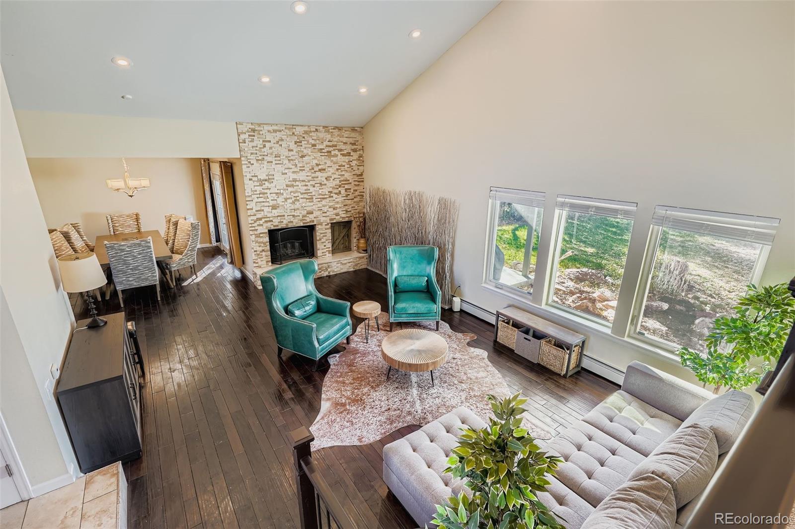3301 South Magnolia Street Denver, CO 80224 - Photo 4 of 33 a living room with furniture fireplace and a large window