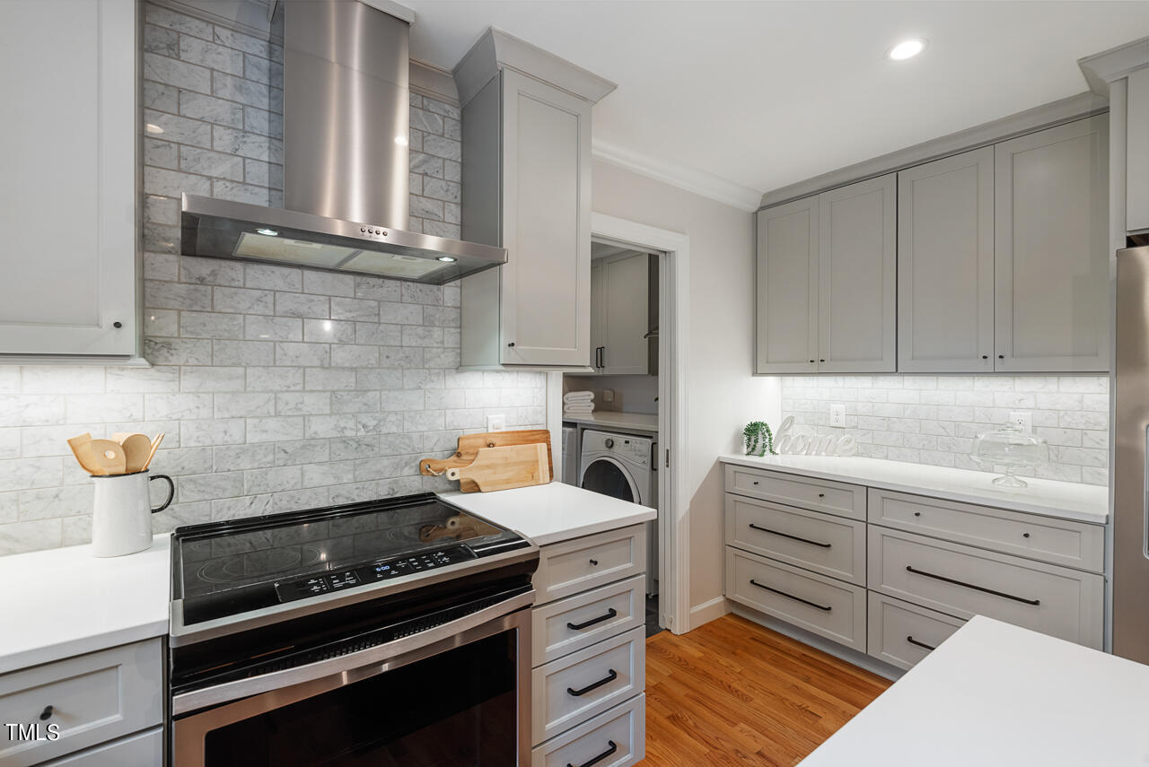 5 Caspian Court Durham, NC 27713 - Photo 16 of 48 a kitchen with cabinets and appliances