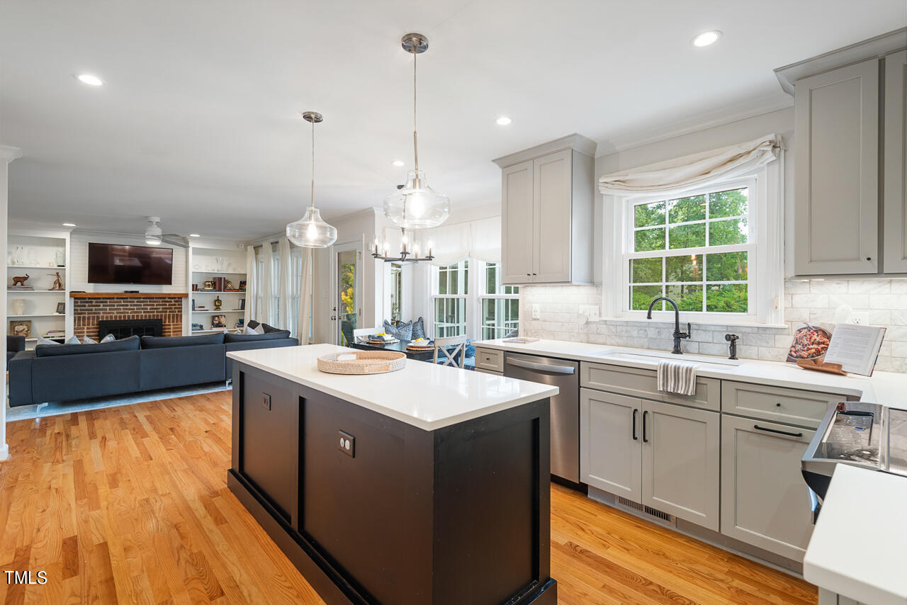 5 Caspian Court Durham, NC 27713 - Photo 17 of 48 a kitchen with a sink a counter top space stainless steel appliances and a window