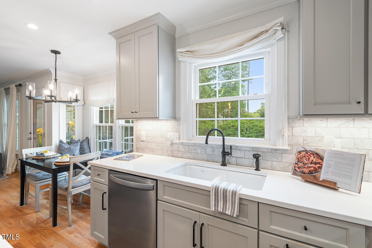 5 Caspian Court Durham, NC 27713 - Photo 19 of 48 a kitchen with a sink cabinets and window