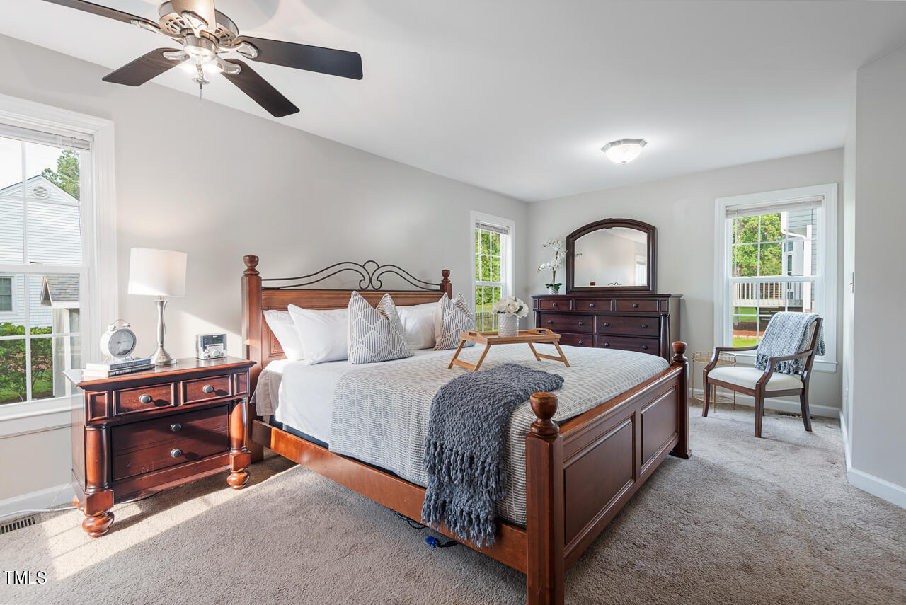 5 Caspian Court Durham, NC 27713 - Photo 21 of 48 a bed room with a bed and a chandelier