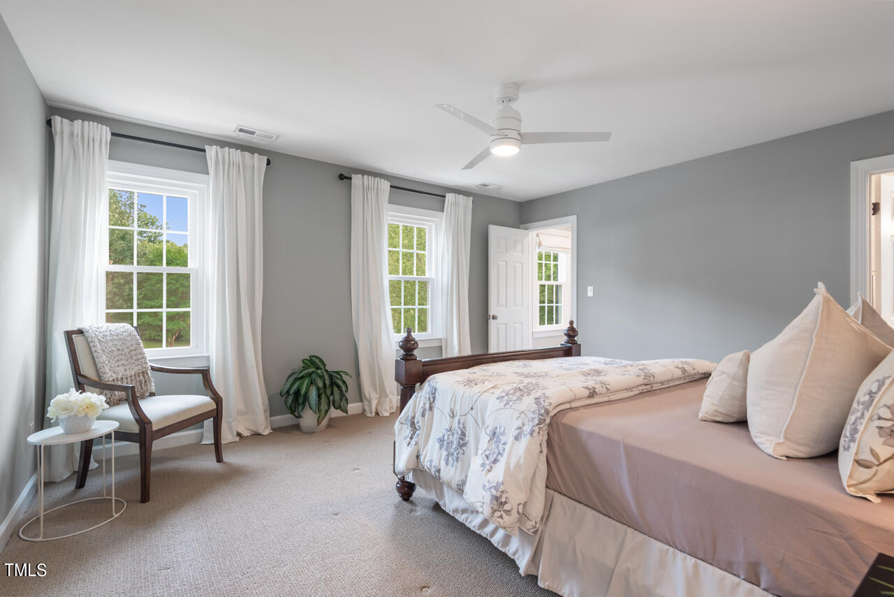 5 Caspian Court Durham, NC 27713 - Photo 27 of 48 a bedroom with a bed chair and window