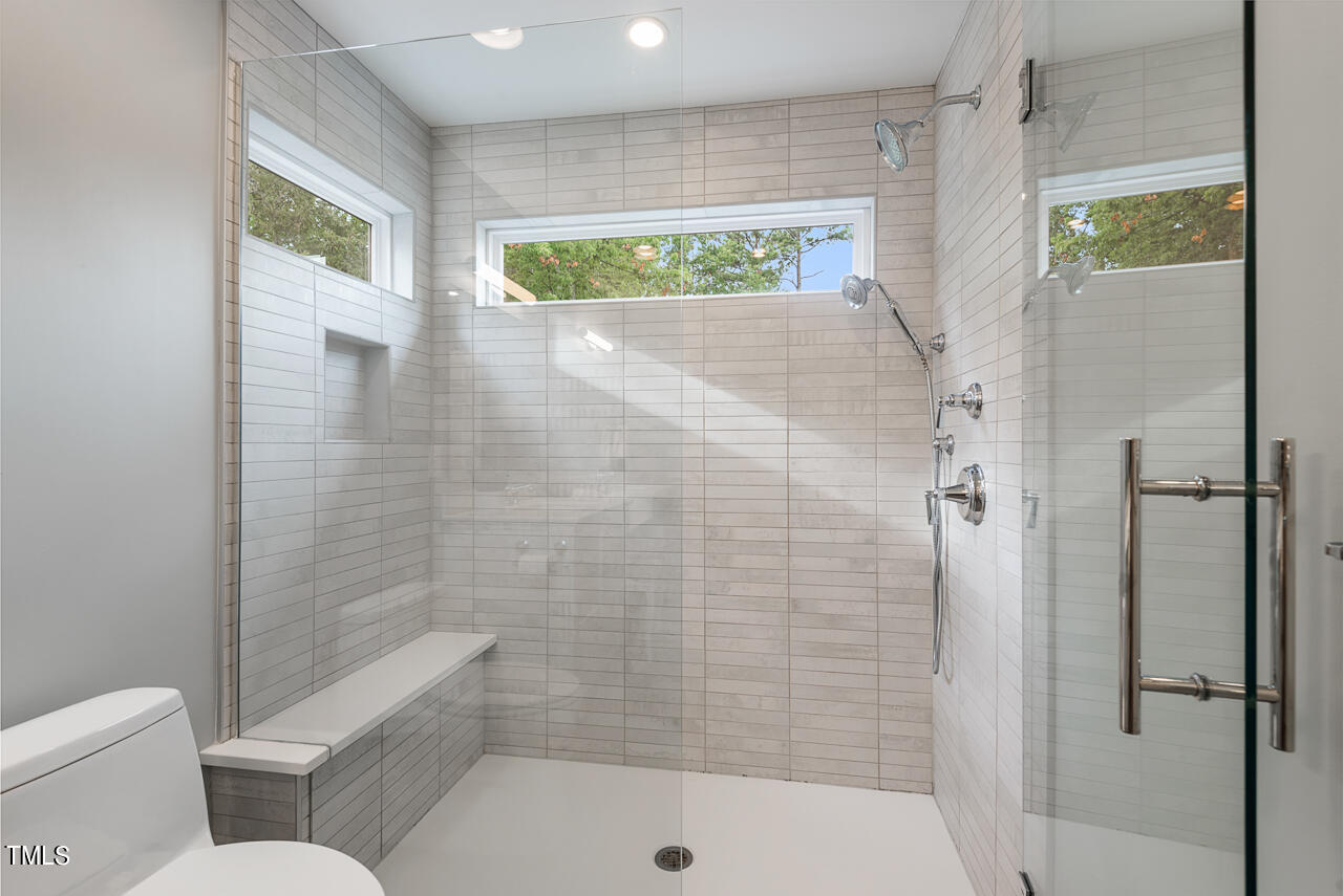 5 Caspian Court Durham, NC 27713 - Photo 31 of 48 a bathroom with a shower and a toilet