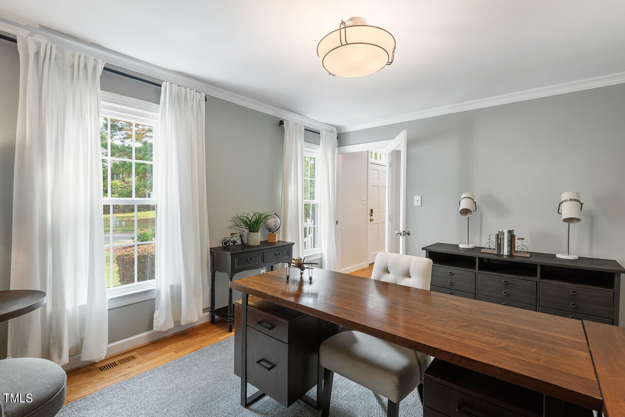 5 Caspian Court Durham, NC 27713 - Photo 4 of 48 a view of a dining room with furniture window and wooden floor
