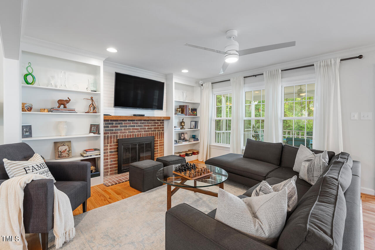 5 Caspian Court Durham, NC 27713 - Photo 8 of 48 a living room with furniture fireplace and a flat screen tv