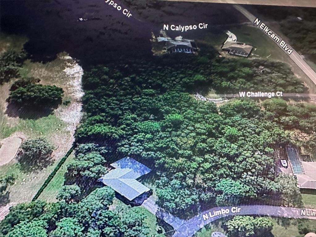 2981 West Challenge Court Citrus Springs, FL 34434 - Photo 3 of 7 an aerial view of a house with yard swimming pool and outdoor seating