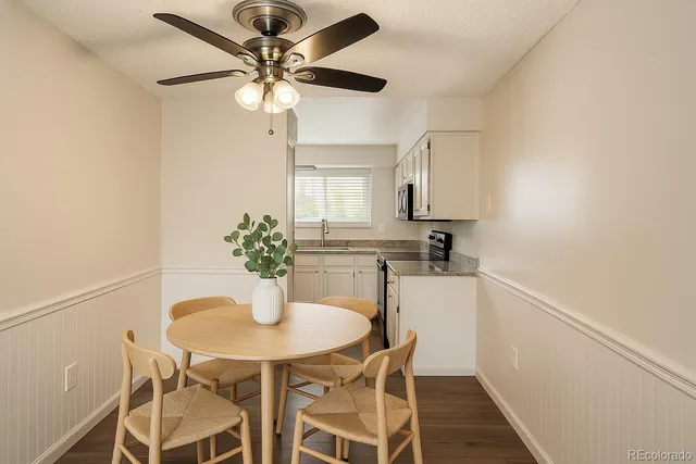 a view of a dining room with furniture and wooden floor