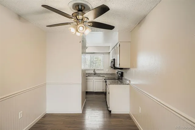 a kitchen with stainless steel appliances a stove a sink and a refrigerator