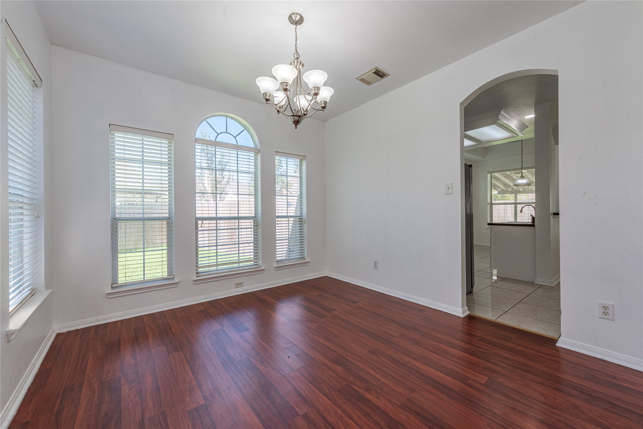 9518 Stone Terrace Court Houston, TX 77089 - Photo 11 of 27 a view of an empty room with wooden floor and a window