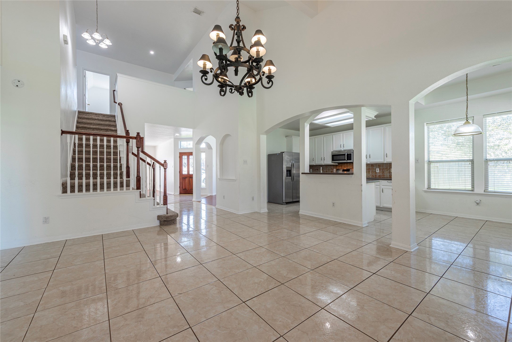 9518 Stone Terrace Court Houston, TX 77089 - Photo 14 of 27 a view of a kitchen with a sink and a refrigerator