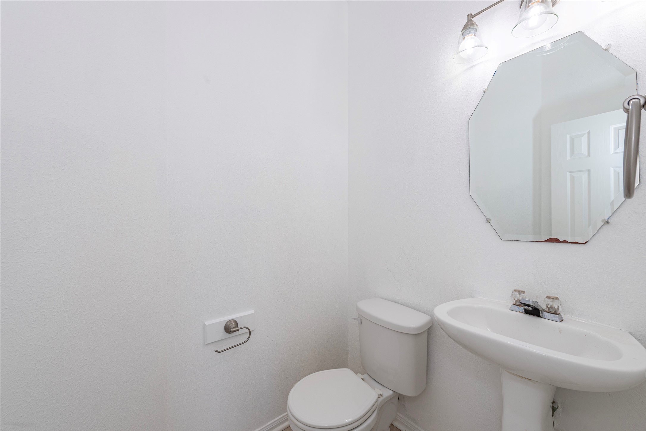 9518 Stone Terrace Court Houston, TX 77089 - Photo 21 of 27 a bathroom with a sink mirror and toilet