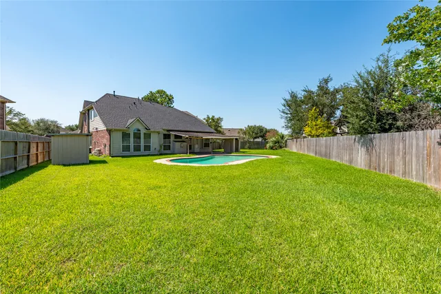 a view of a house with a big yard