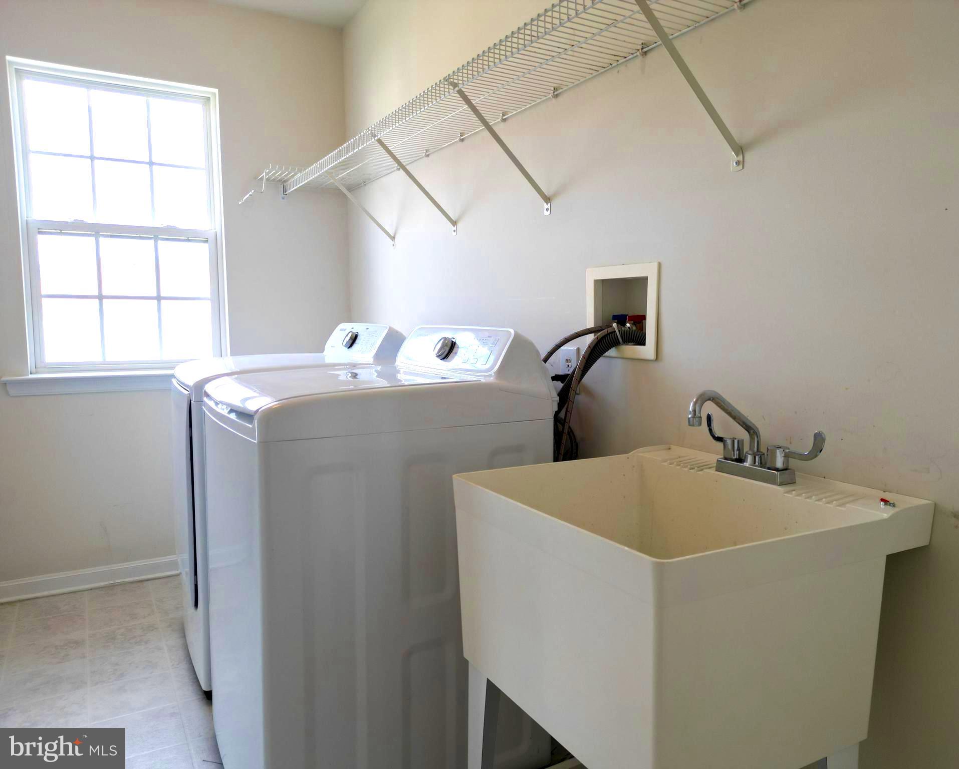 107 Newgate Circle Smyrna, DE 19977 - Photo 31 of 45 a utility room with dryer and washer