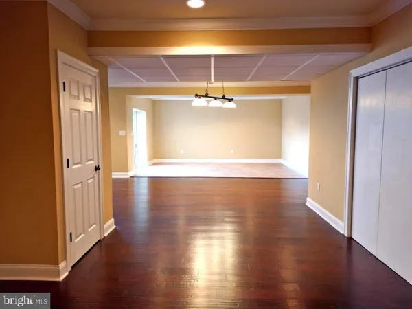 a view of a livingroom with wooden floor
