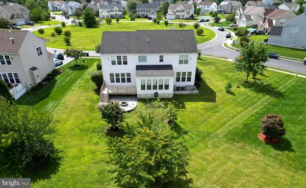 an aerial view of a house with a garden
