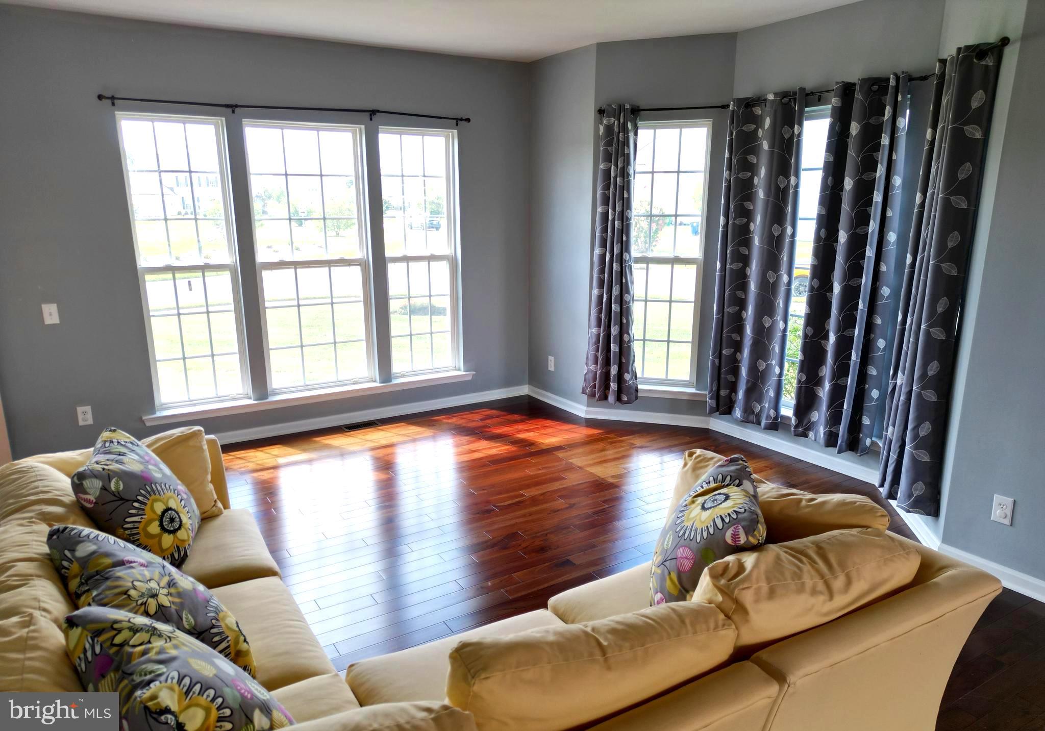 107 Newgate Circle Smyrna, DE 19977 - Photo 8 of 45 a bed sitting in a bedroom next to a window