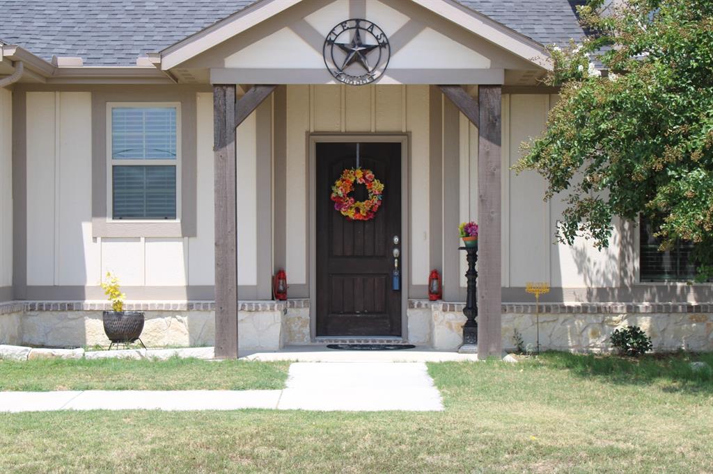2267 County Road 4010 Decatur, TX 76234 - Photo 6 of 36 a front view of a house with garden