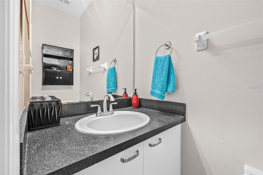 1050 Starkey Road, Unit 604 Largo, FL 33771 - Photo 14 of 28 a bathroom with a sink and a mirror