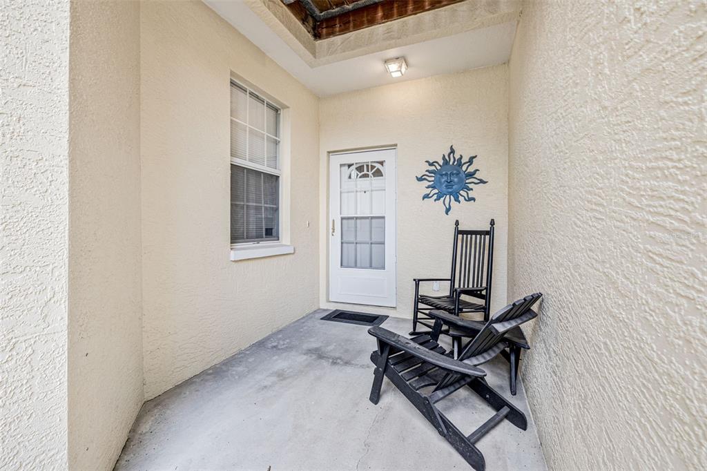 1050 Starkey Road, Unit 604 Largo, FL 33771 - Photo 3 of 28 a room with table closet and wooden floor