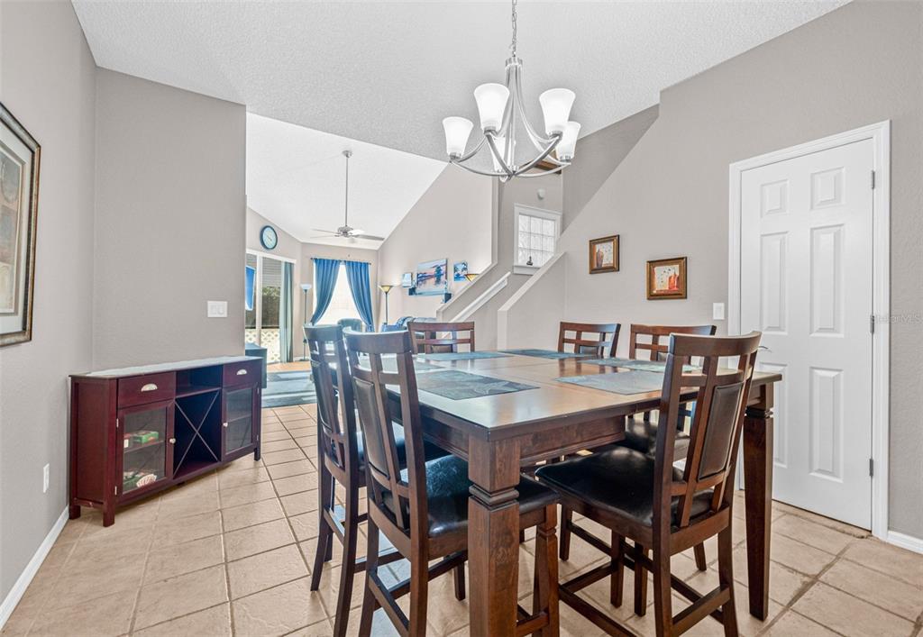 1050 Starkey Road, Unit 604 Largo, FL 33771 - Photo 4 of 28 a view of a dining room with furniture and chandelier