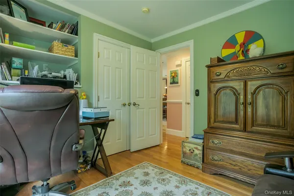 a view of a livingroom with furniture and staircase
