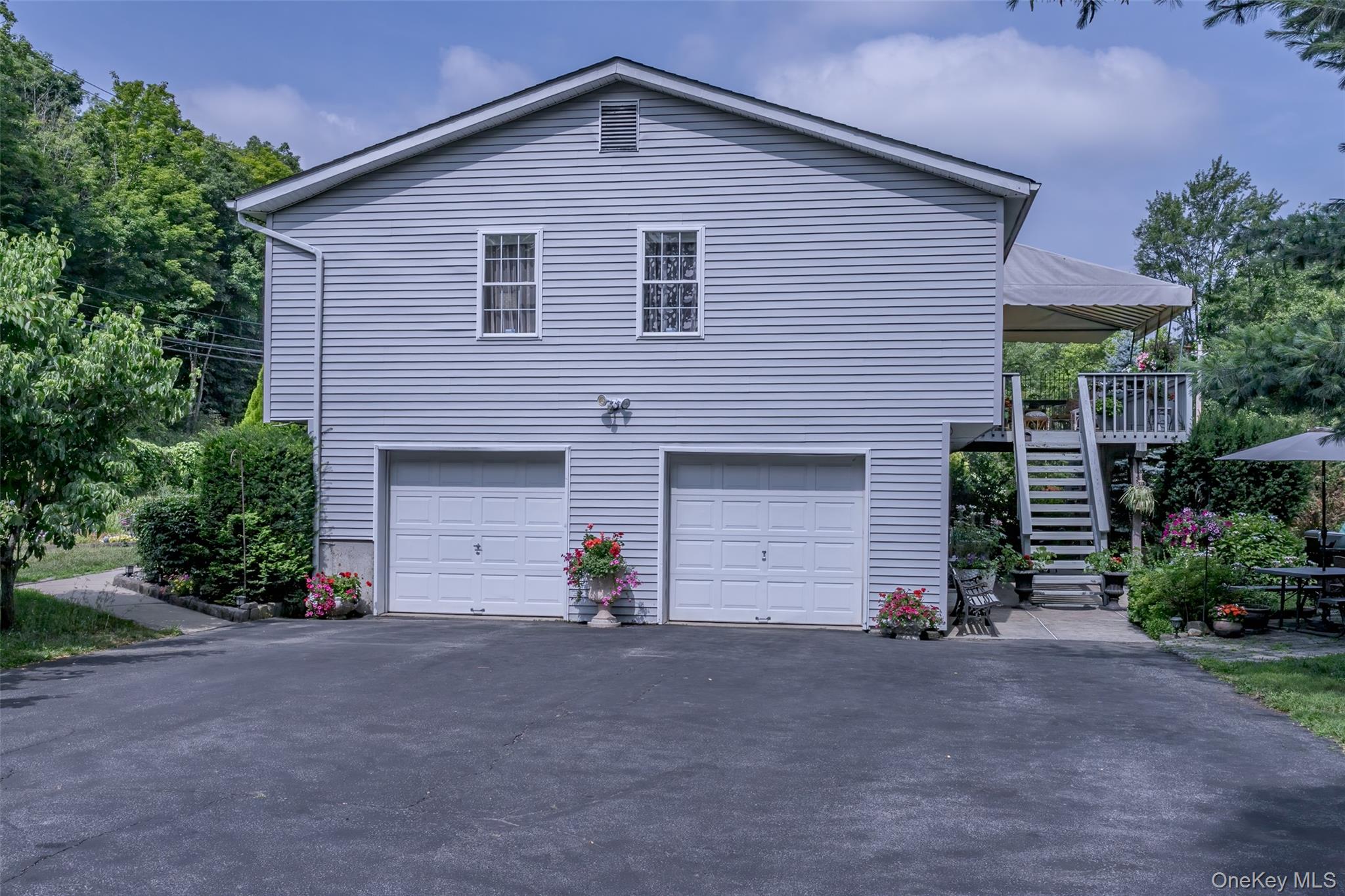 300 Mountain Lodge Road Monroe, NY 10950 - Photo 28 of 41 a front view of a house with a yard and garage