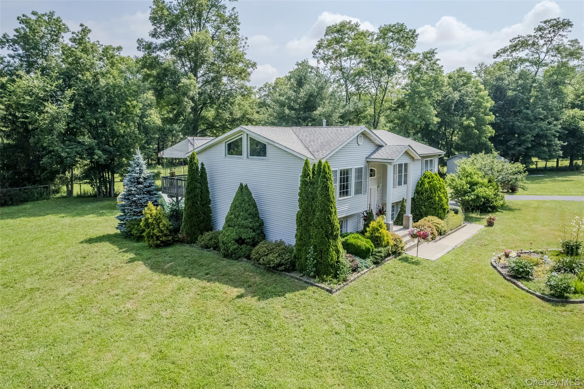 300 Mountain Lodge Road Monroe, NY 10950 - Photo 37 of 41 a view of a house with a yard and sitting area
