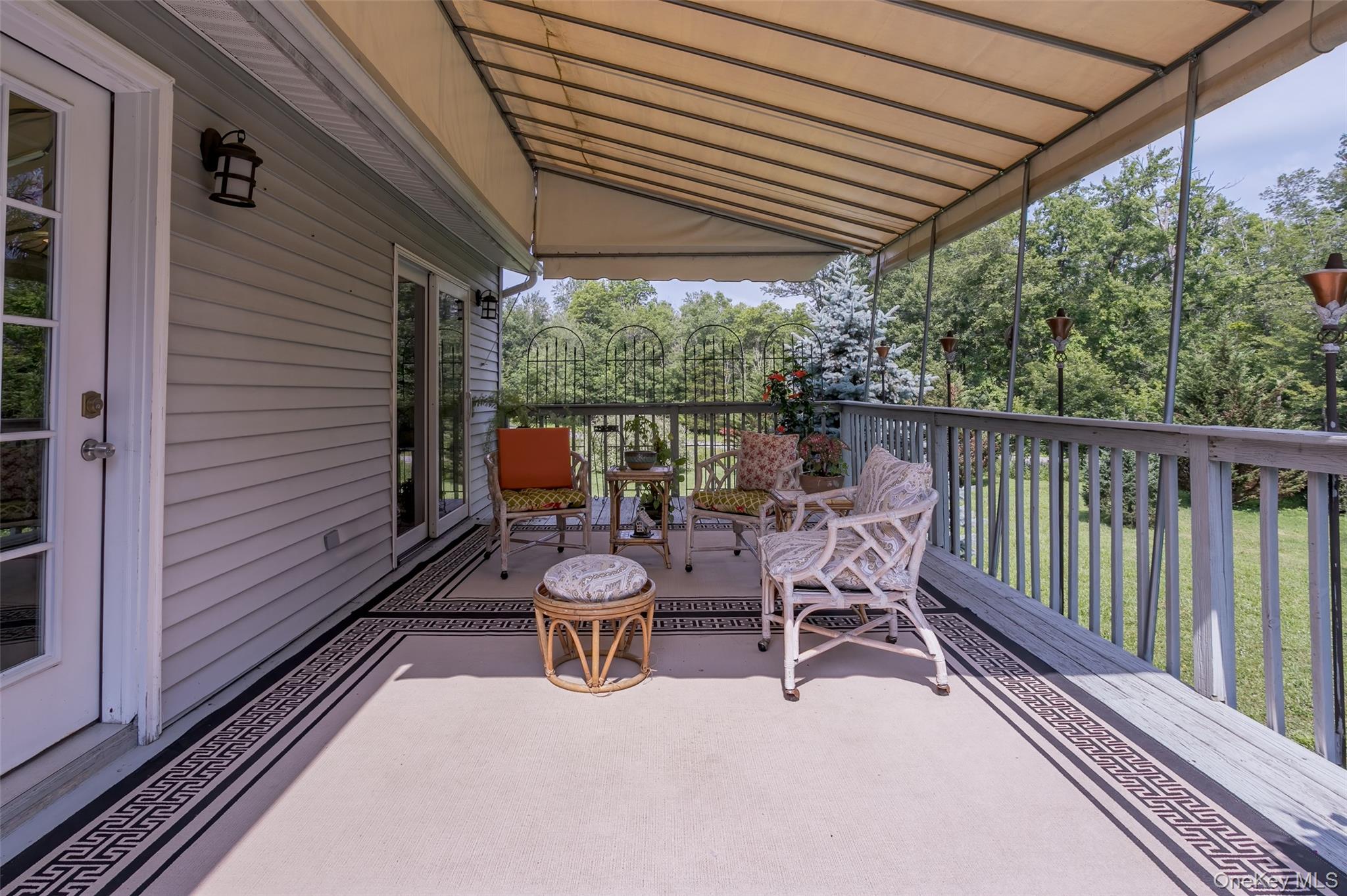 300 Mountain Lodge Road Monroe, NY 10950 - Photo 9 of 41 a view of a patio with a table chairs and a backyard