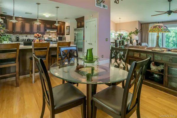 a view of a dining room with furniture and a table