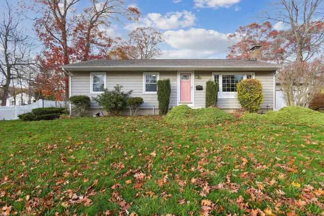 front view of a house with a yard