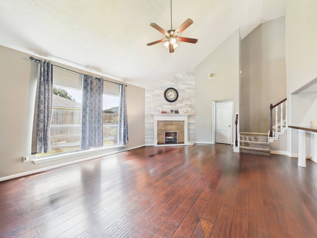 1484 Allison Street Alvin, TX 77511 - Photo 11 of 37 a view of an empty room with wooden floor and a window