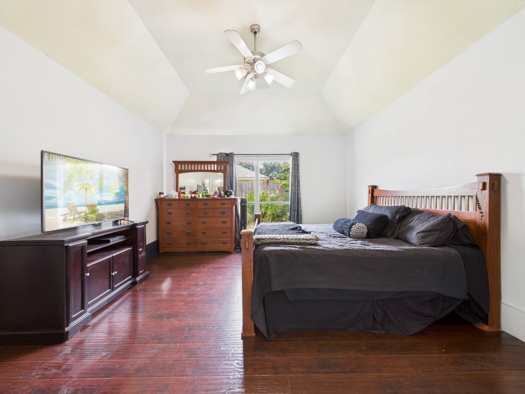 1484 Allison Street Alvin, TX 77511 - Photo 19 of 37 a living room with furniture and a flat screen tv