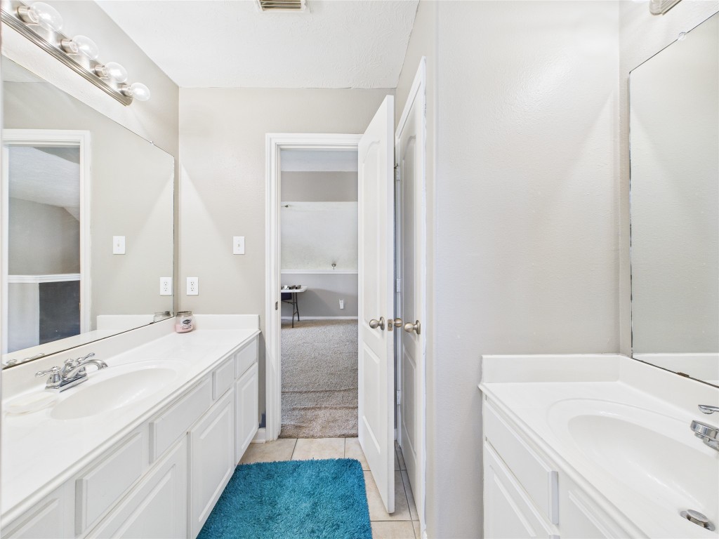1484 Allison Street Alvin, TX 77511 - Photo 32 of 37 a bathroom with a double vanity sink mirror and double
