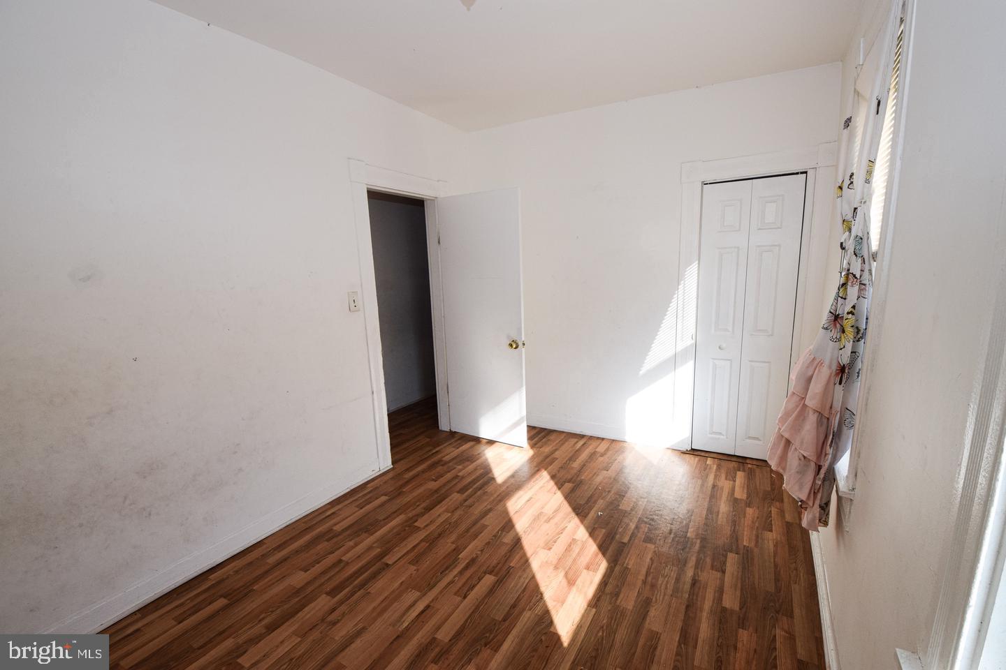 2101 West Baltimore Street Baltimore, MD 21223 - Photo 12 of 19 a view of wooden floor in an empty room