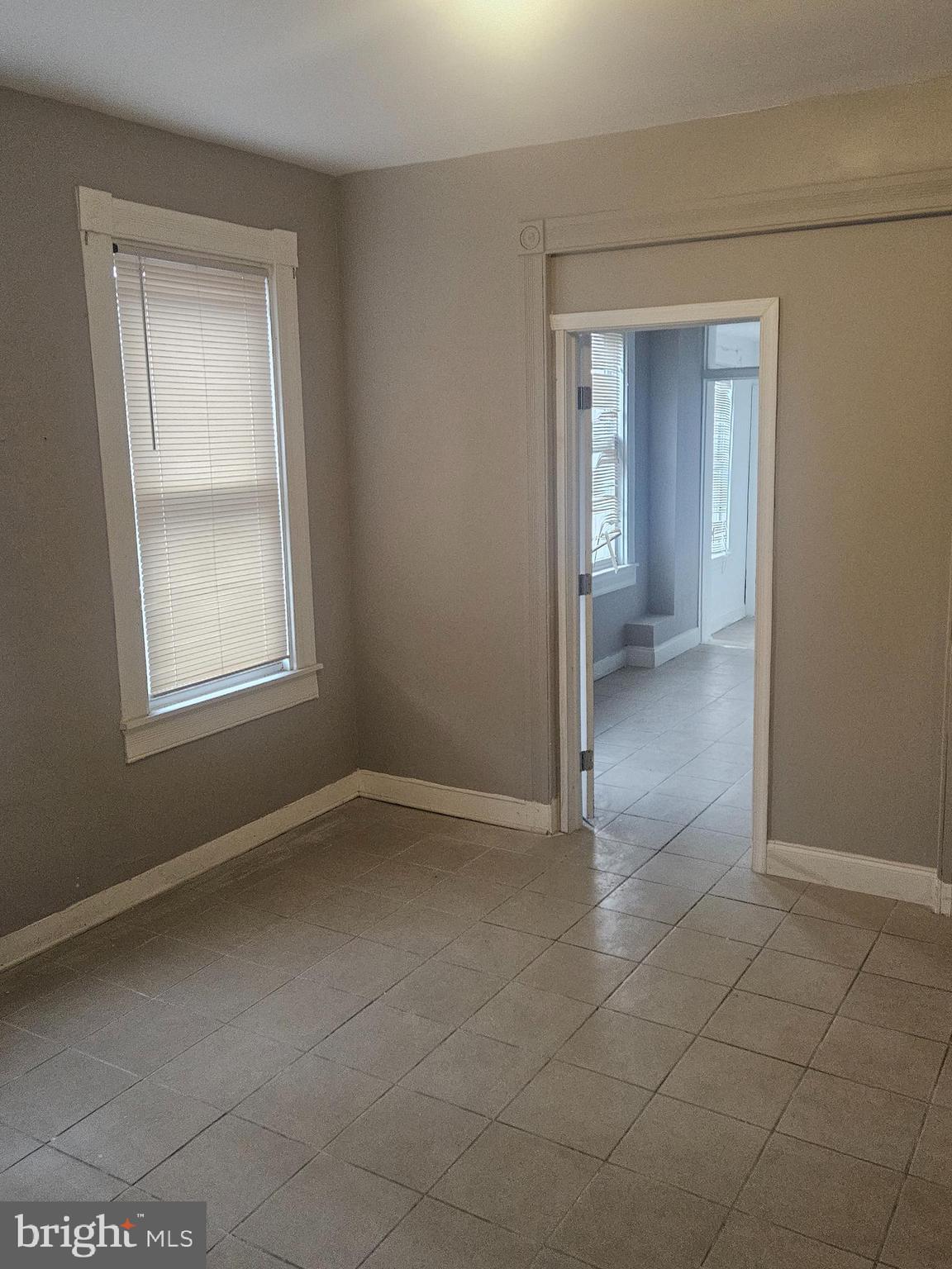 2101 West Baltimore Street Baltimore, MD 21223 - Photo 3 of 19 a view of an empty room with closet and a window