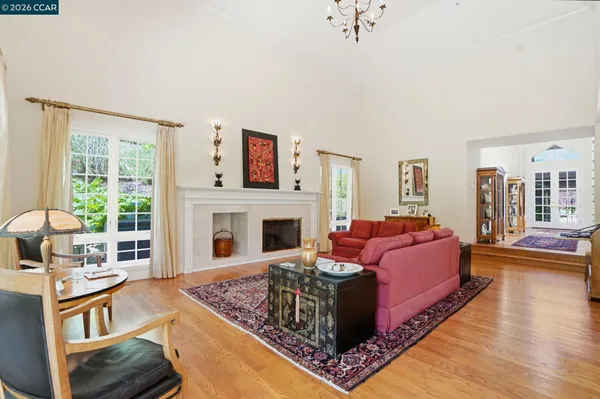 a kitchen with stainless steel appliances granite countertop a sink stove and wooden floor